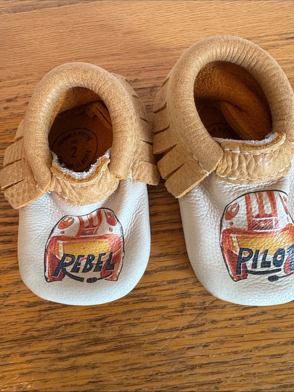 Freshly Picked Tan & White Moccasins with Rebel Pilot Graphic